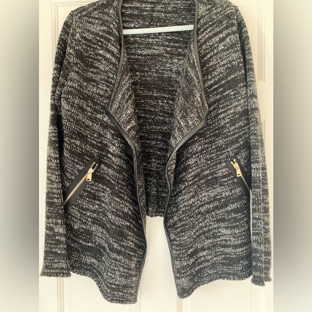 Swing front sweater jacket with leather look trim and gold tone zippers